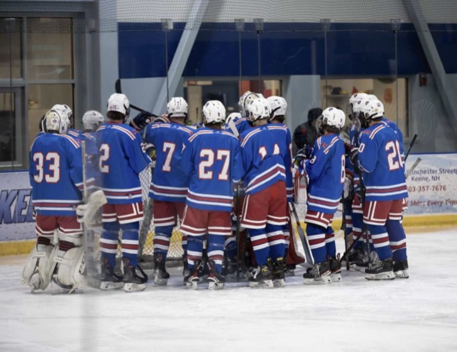 The team huddles during an intermission to discuss plays and tactics. The Lancers have advanced to the Semifinals after winning against Windham at the Quarterfinals with a final score of 2-1 in Overtime.