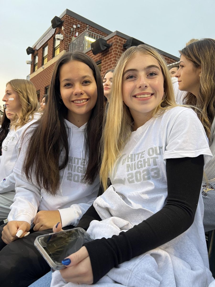 Sophomores Alexandra Pena and Annabelle Hicks are taking on tonight's game by wearing white to support their football team!