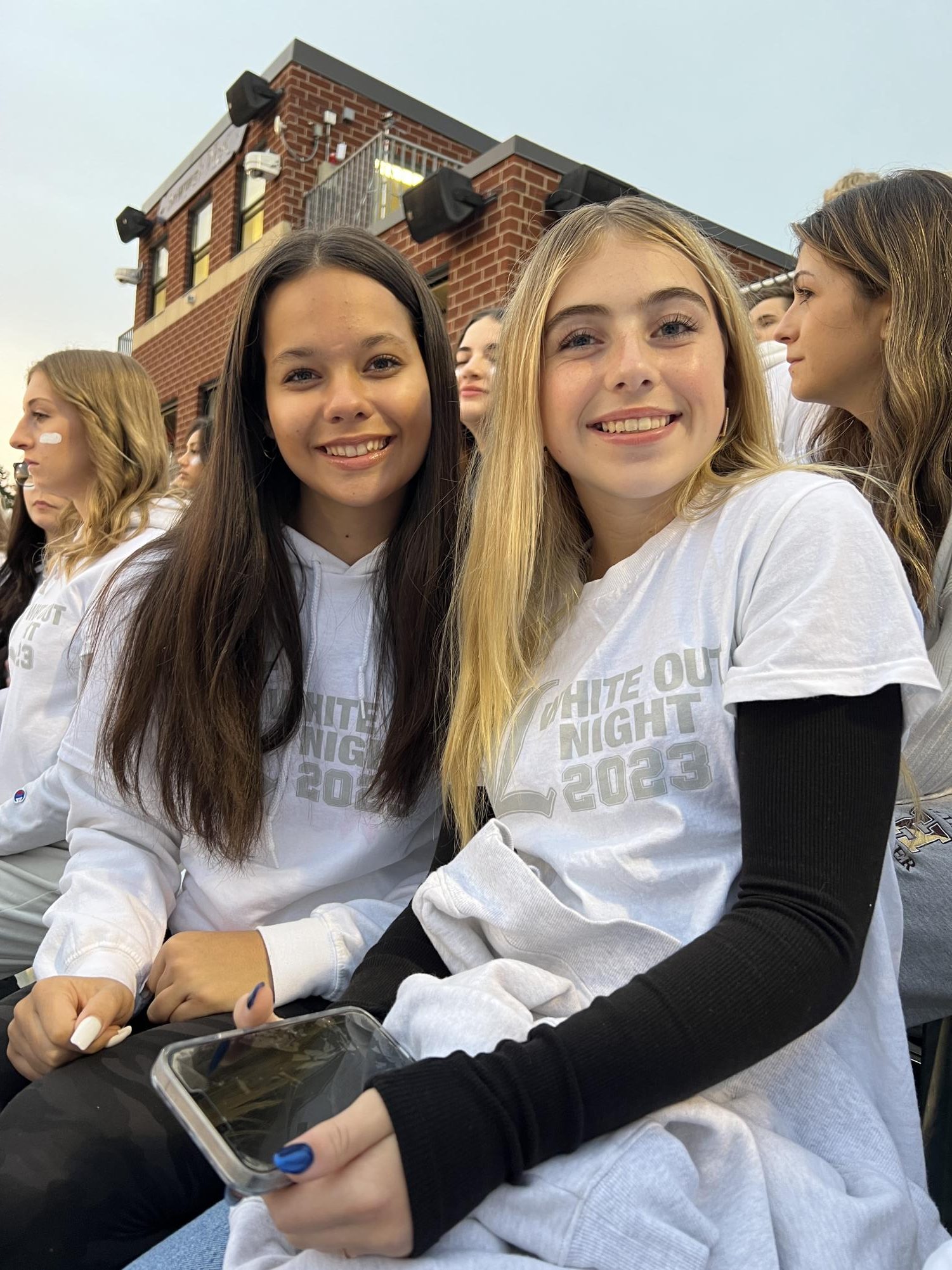 Sophomores Alexandra Pena and Annabelle Hicks are taking on tonights game by wearing white to support their football team!