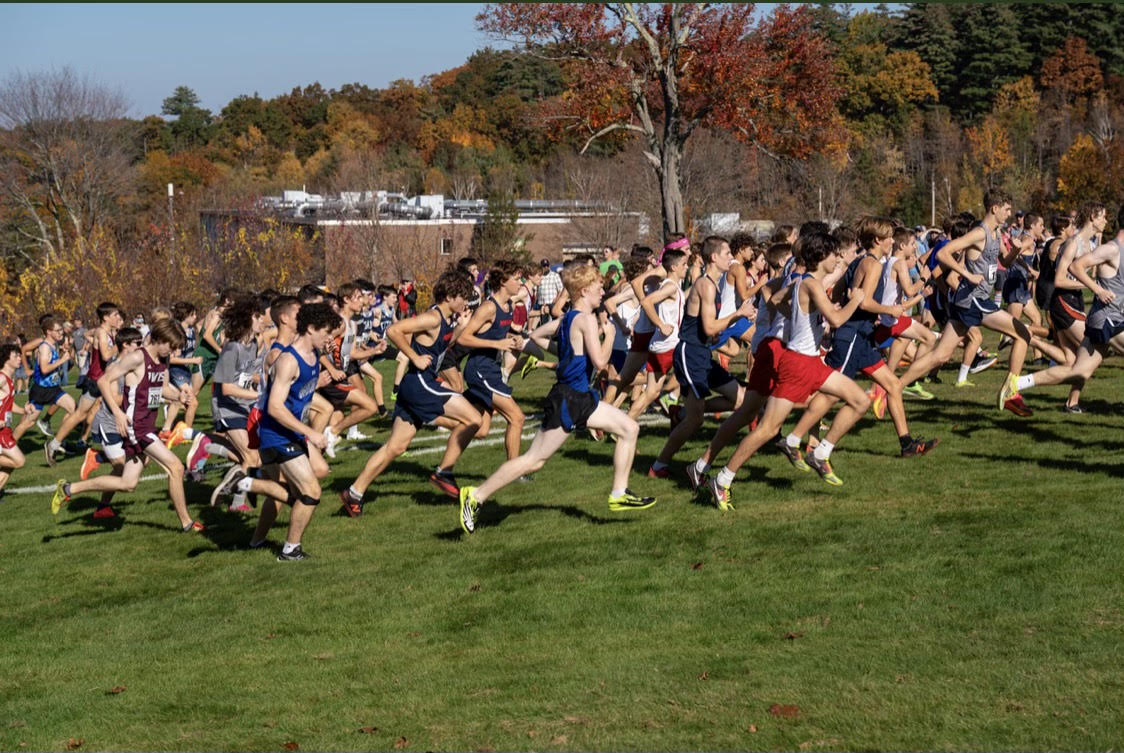 Lancers run through a field at the Derryfield meet.