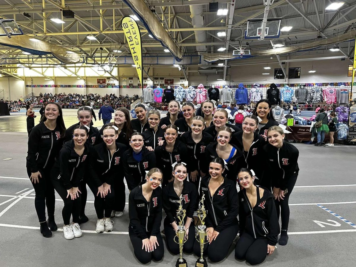 The Lancer Dancers proudly hold their trophy after winning both of the categories they competed in. (Photo used with permission by Liv Labranche).