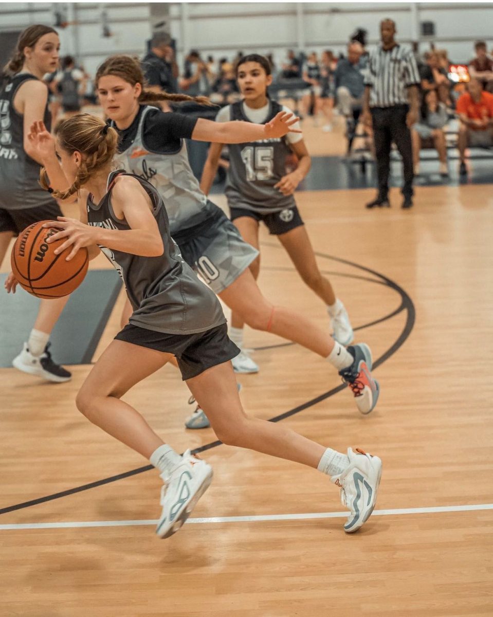 Freshmen Gemma Murray drives to the basket to try and get a bucket.