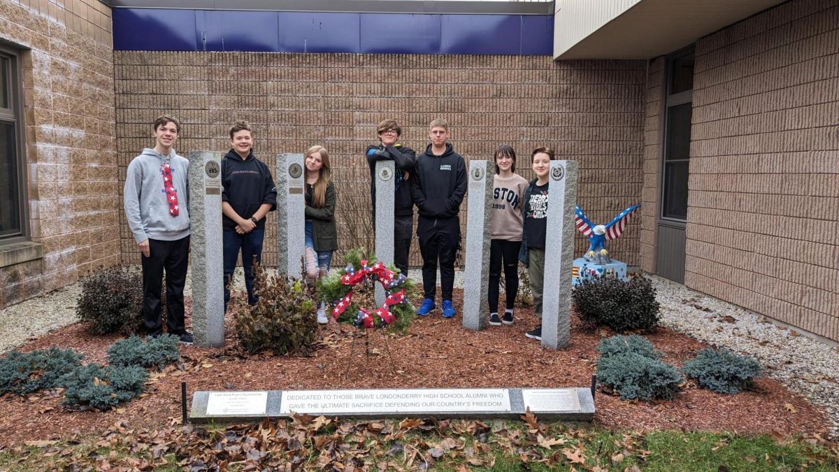 The Blue Star and Purple Star Lancers stand in the Garden where all troops have been remembered. They will continue their tradition of sending care packages to troops who are currently deployed and connected to Lancer Nation. 

Pictured: Senior Asher Cometois, Jack Griffin, Hope Tessier, Junior Bailey Clevenger, Sophomore Keegan Woolverton, Kelsey Sweet, and Freshman Parker Tessier. 