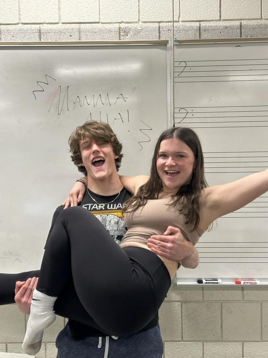 Junior Mason Turek lifts junior Maddie Tufts during a dance rehearsal for Mamma Mia.