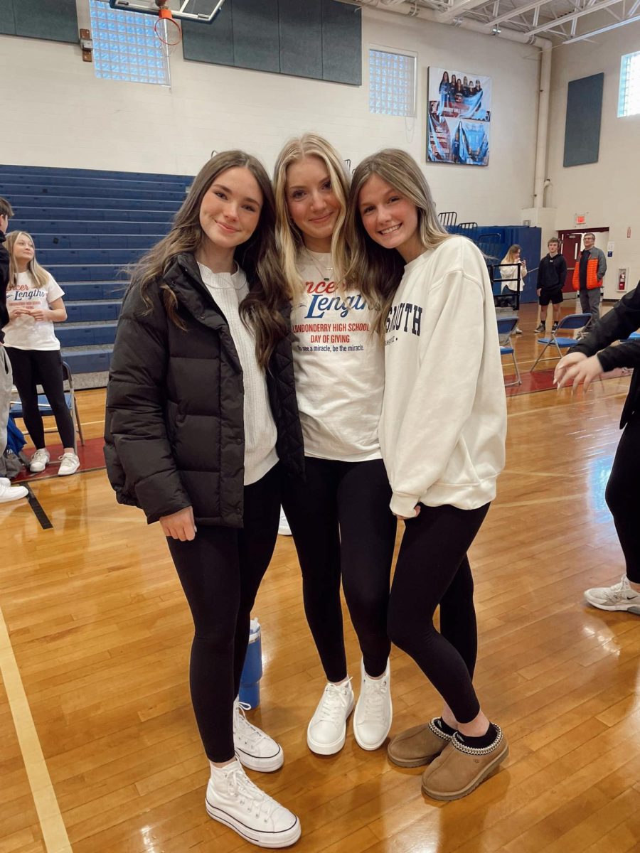 After donating her hair, Morgan Laczynski is smiling away with her two biggest supporters. 