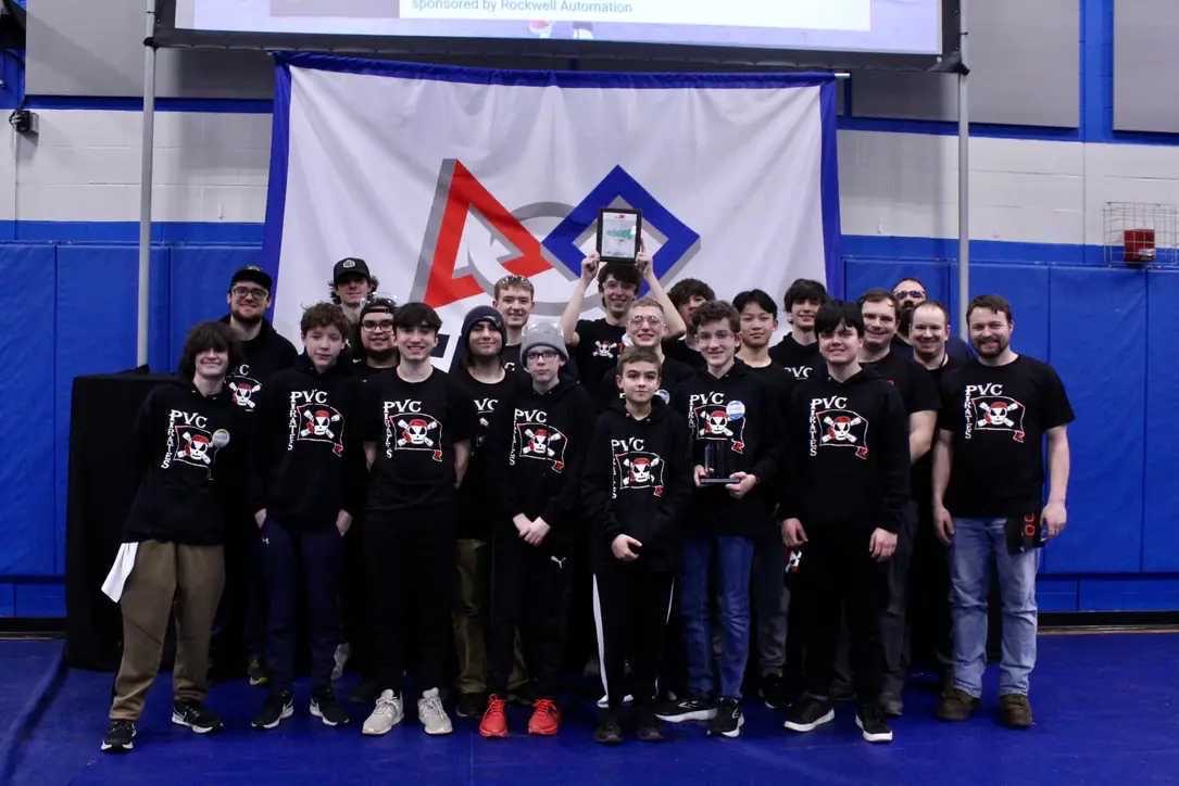 Team 1058 (the Londonderry Robotics Team) poses with the autonomous award won at the Granite State District event.