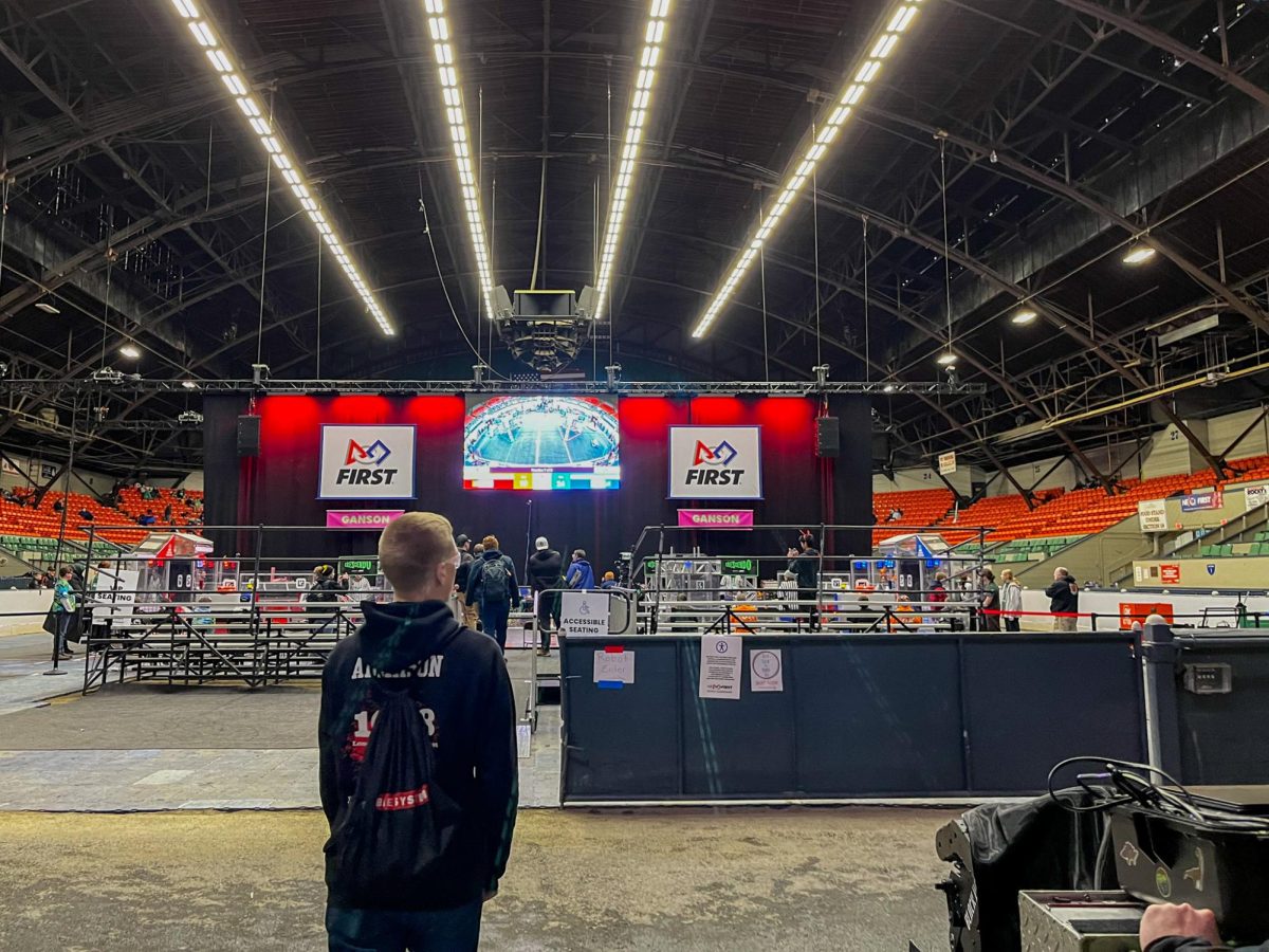 Robot Driver Brandon Adamson overlooks the field for the 2024 DCMP Competition.