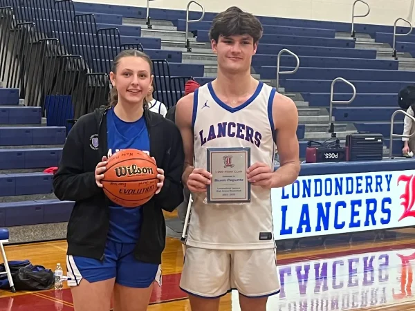 Sammie Sullivan (left) and Mason Paquette (right) receive recognition after both achieving the 1000 point milestone on January 21, 2025. (Photo by Roger Brown)
