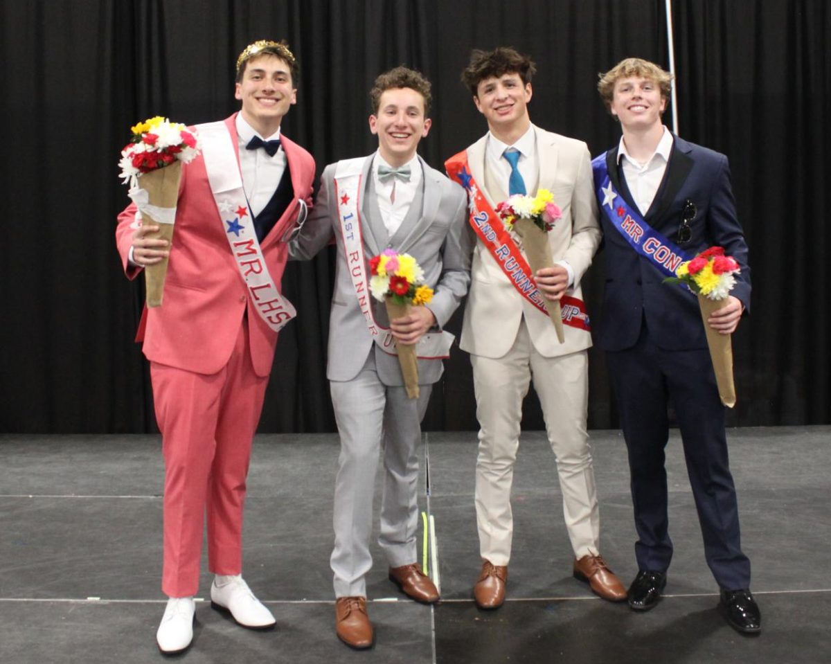 Blake Thompson, Dylan Anderson, Noah Celio and Evan Fortin all stand together showing off their winning sashes.
