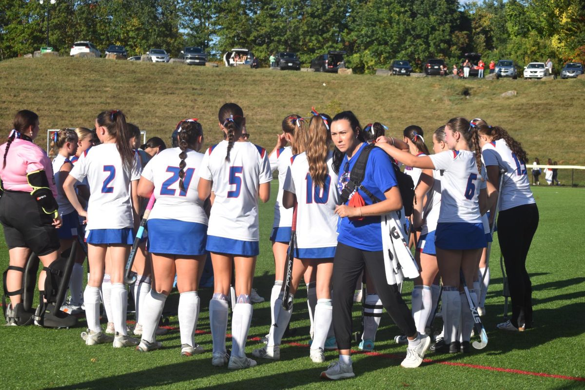 Team talks about how to win the game during halftime. 