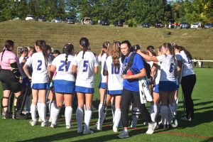 Team talks about how to win the game during halftime. 