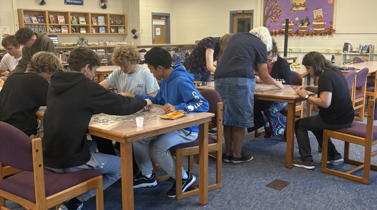 Students and teachers compete in teams during the recent Puzzle Showdown on October 8, 2025 from 2:30 - 3:00 in the LHS library. The fastest team to finish their puzzle won a gift card prize at the end. “It was fun,” Sophomore Garret Nahlik said, who was part of the winning team. 

Photo by Mia Robinson
