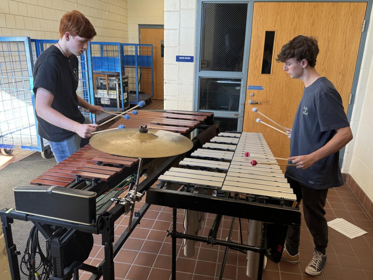 Junior Alex Fontaine (right) plays the vibraphone with junior Brendan Saich (left), who plays the marimba, to prepare for their Prism Concert audition. They will be performing the song “Satellite” by Benjamin Holmes, which Fontaine said is “very modern.”