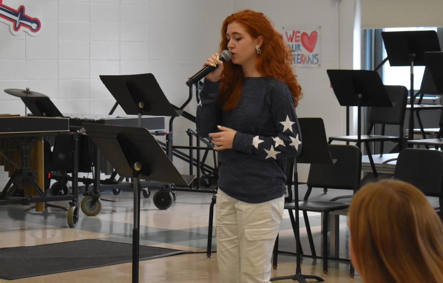 Senior Rebecca “Beck” Solomons performs “Amazing Grace” and “America the Beautiful” for the veterans. 