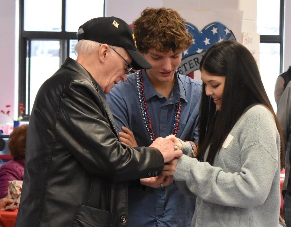 Senior Sienna Piland shares a special moment with her grandfather, an Air Force veteran, at the Veterans Breakfast. 