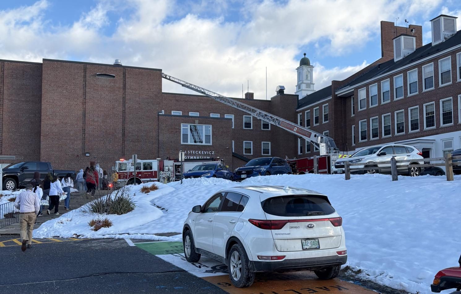 Students evacuate C.J. Steckevicz Gymnasium when the fire alarm gets triggered due to excessive flames in cooking rooms on Dec. 11. (Photo by Chris Murray)