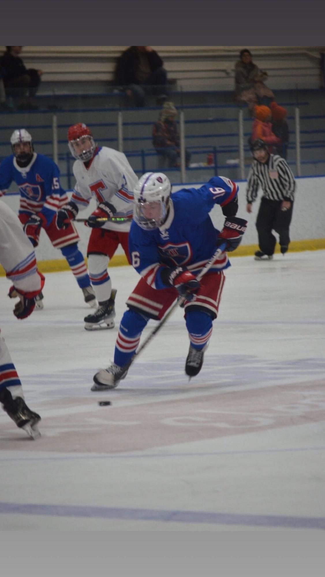 Senior Tucker Reynolds looks to use his speed on the outside of the ice. And focus on the puck throughout the play in case someone is open for a pass. (Photo used with permission from Lyndi McKinnon)