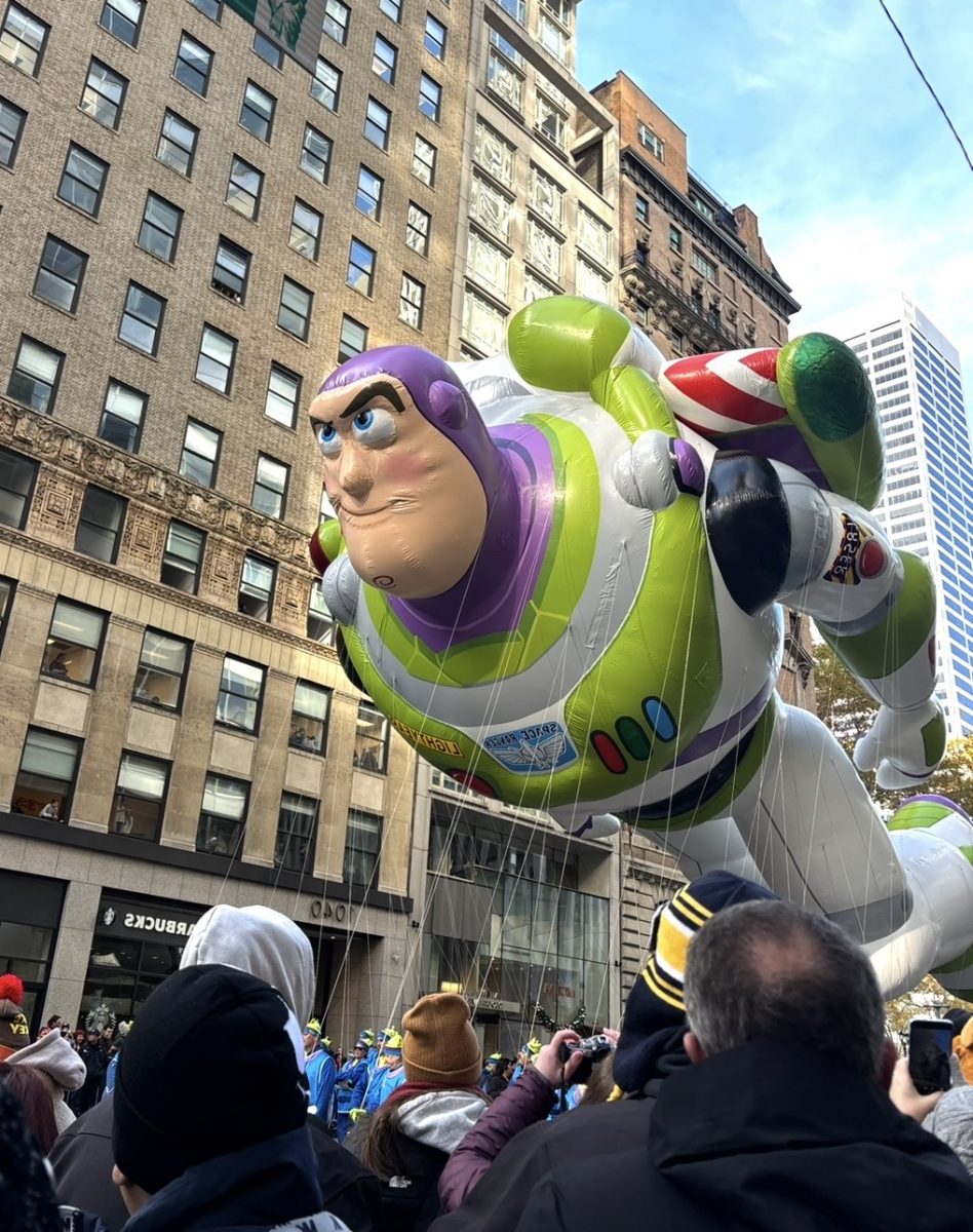 Buzz Lightyear soars to infinity and beyond over the Macy's Thanksgiving Day Parade crowd. This balloon celebrated Toy Story's 30th anniversary with a brand-new design.