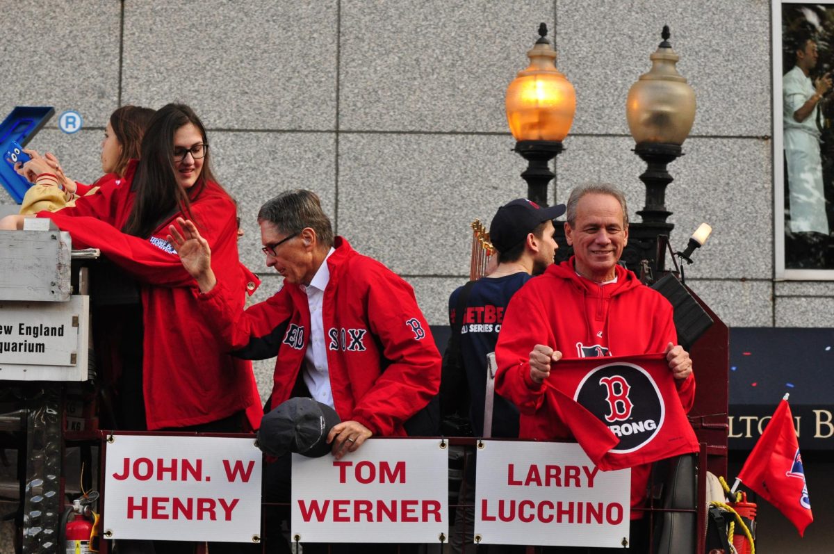"Larry Lucchino and John W. Henry 2013 (10650272826 full)" by Alicia Porter from New Bedford, Massachusetts, United States is licensed under CC BY 2.0.