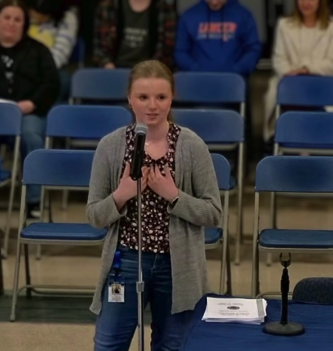 Senior Kelsey Sweet speaks in front of the school board during the budget hearing on Jan. 15. Sweet shared that she utilizes the school library almost every day and has seen  what the library assistants do. "They maintain a calm, organized environment," Sweet said. "If even one of these positions is cut, the impact will be immediate and severe.”  (Screen capture from Londonderry School District YouTube)