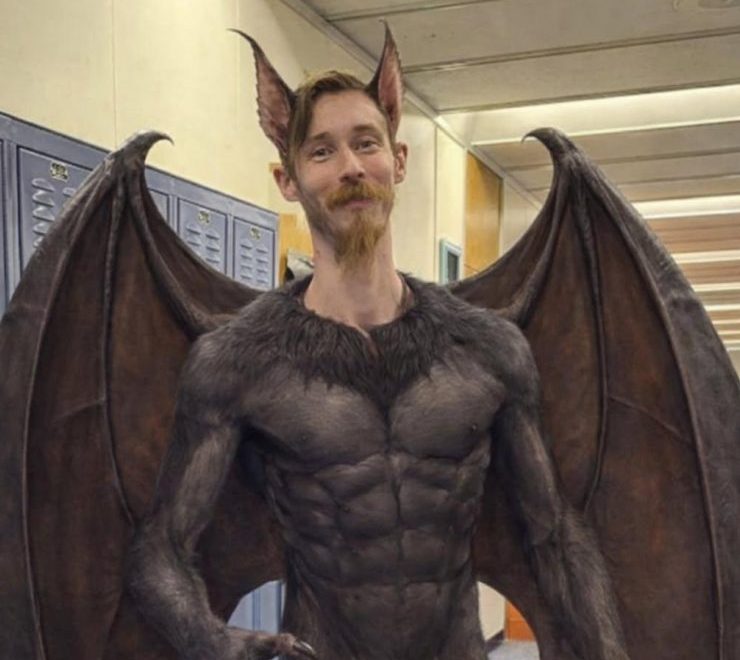 Custodian Sam Bailey earned the nickname “Batman” after safely handling an unexpected bat inside campus, turning an ordinary day into a heroic moment. “Honestly, I'm just the high school custodian who's doing his job,” Bailey said. “I caught him with the net, but the science department had a big part in helping catch the bat.”
(AI photo illustration created by Brian Costigan.)