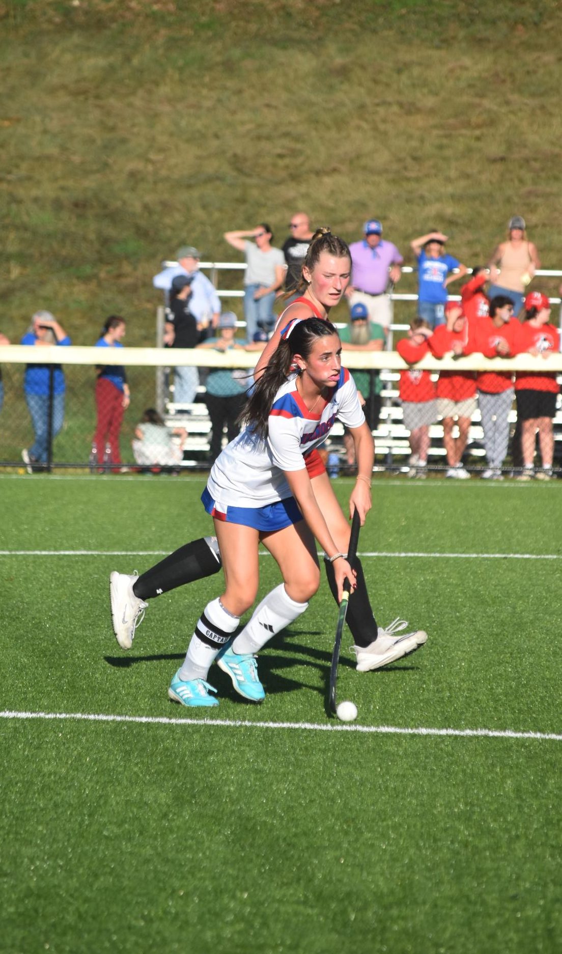 Senior Alison Chambers dribbles the ball up the field during the Mack Plaque field hockey game at Pinkerton Academy. Facing one of their most competitive opponents of the season, the team relied on one another to maintain control throughout the matchup. “It was a really intense game, but we stayed composed and trusted each other to get the job done,” Chambers said.