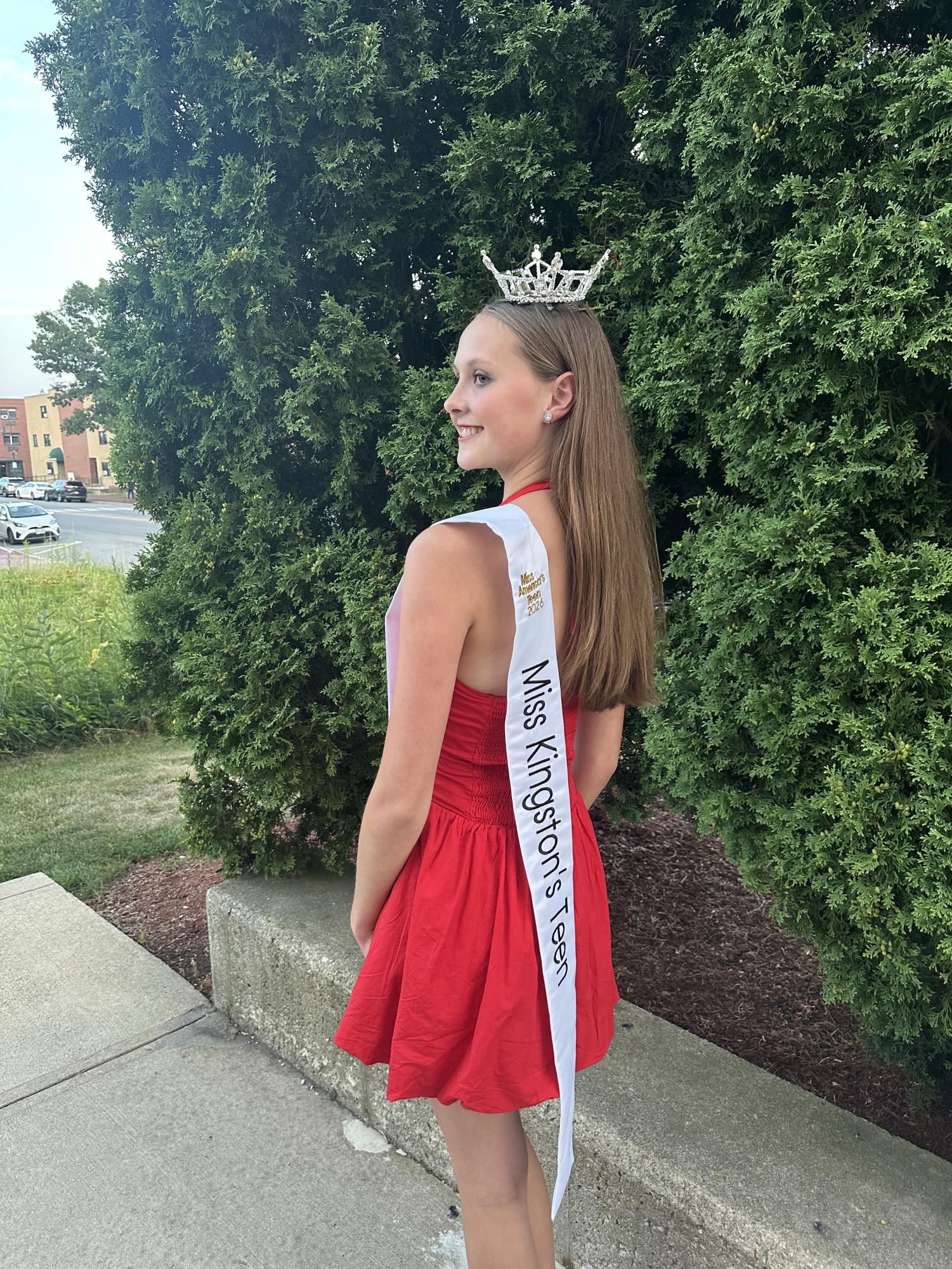 Miss Kingston’s Teen, freshman Aria Bound, attends a local pageant as she publicizes her latest fundraiser for Miss America’s Teen. Bound is currently selling handmade bracelets to help reach her goal. “When people see me anywhere in NH with my crown and sash, everyone asks what town I’m representing and sometimes people will say they live there or know someone from there,” Bound said. “It’s fun to see all these people talk to me and ask me questions about my community service and how I like being Miss Kingston’s Teen.”(Photo used with permission by Aria Bound.)
