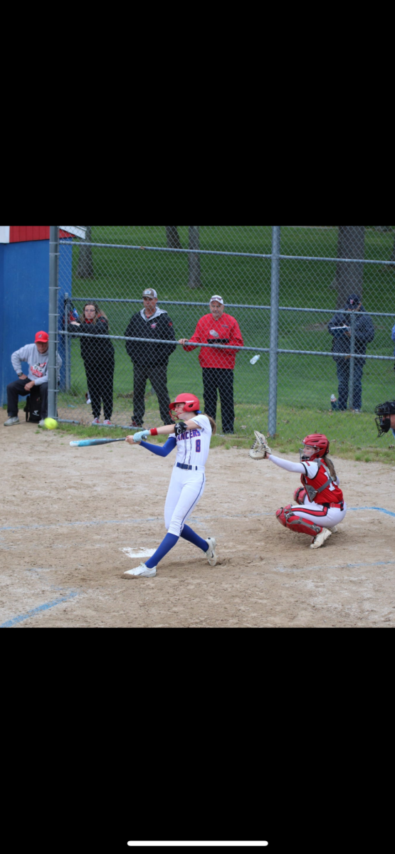 Kearney shows off her beautiful swing and drives a ball into the air.