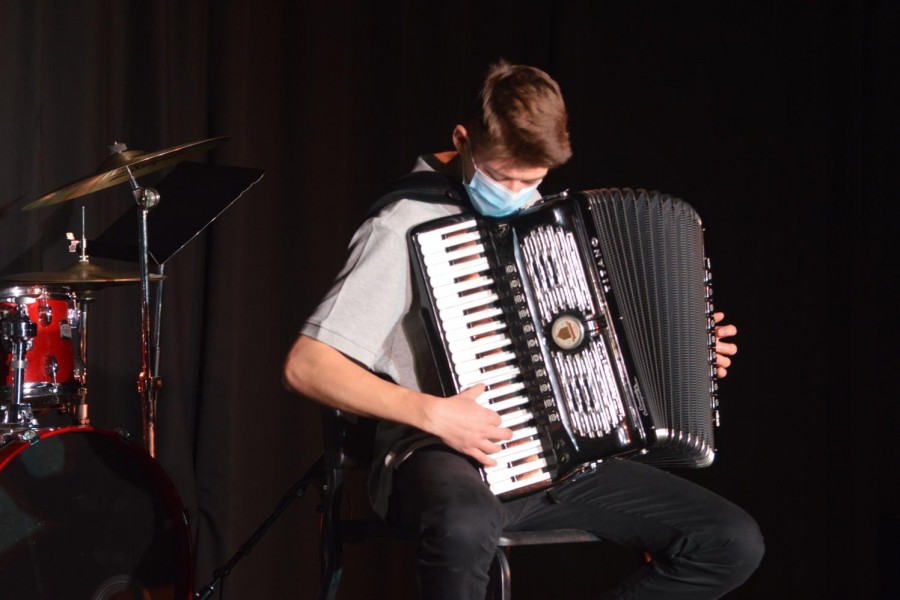 Camden Poitras plays the accordion in his performcance of "Accordian Boogie" in the later half of the Prism concert.