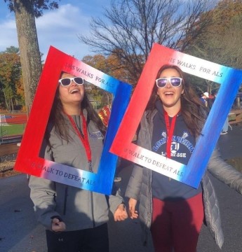 Seniors Olivia Chau and Tess Brown volunteer to help the event run smoothly.