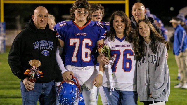 Brian Barbaro celebrates Senior Night with his family.