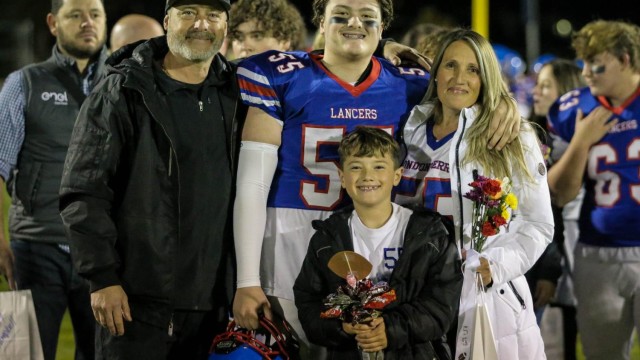 Devin Ortiz celebrates senior night with his family.