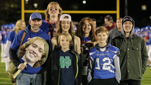 Grady Daron celebrates senior night with his famiy.