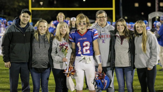 Hayden Austen celebrates Senior Night with his family.
