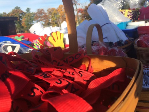 The ALS Association donated a table of free items for participants to take, including lanyards, bracelets, t shirts, and sunglasses.