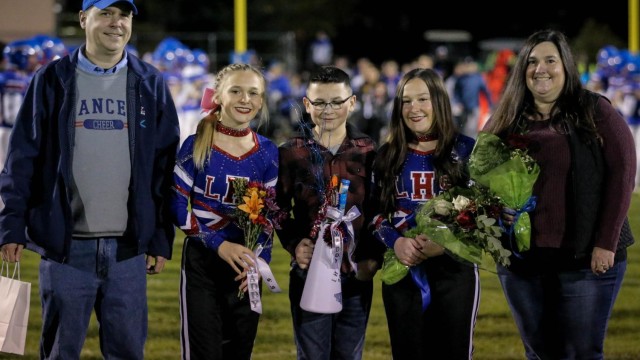 Maddie Ouellette celebrates Senior Night with her family.