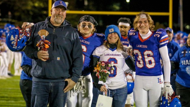 Riley Boles celebrates Senior Night with his family.