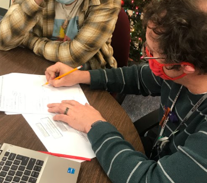 Mr. Guertin helps sophomore Nick Strong with math in room 112. His favorite thing is to help students avoid the same mistakes he made. Photo by Gianna Siracuse