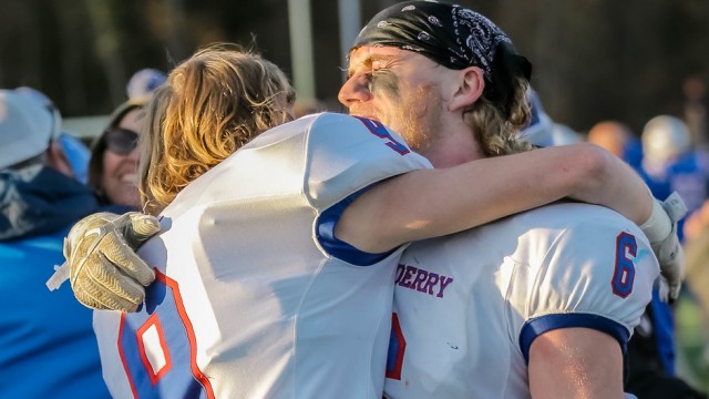 Seniors Riley Boles and Connor Howe share an emotional moment after winning the championship.