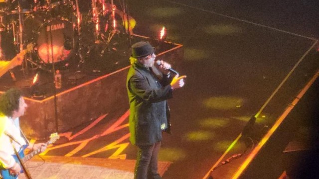 Singer Joseph Williams points to the crowd during "Hold the Line".