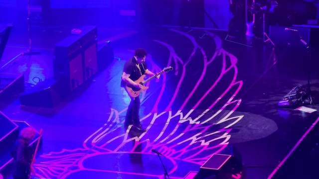 Guitarist Neal Schon shows off his guitar skills in a solo before "Stone in Love".