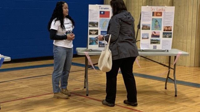 International Club Secretary, Olivia Colliton-Savina, educates a festival goer about Taiwanese culture.
