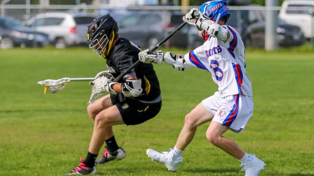 Senior Josh Defranzo prevents Souhegan from getting a goal.